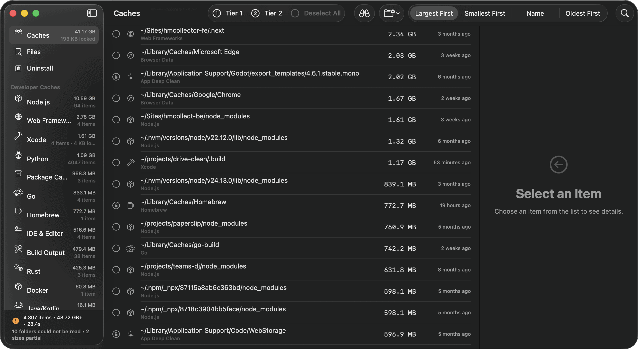 DDCC listing developer caches largest first, each row naming the tool that created it, with a status line reading 48.72 GB plus.